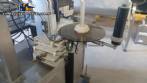 Automatic self-adhesive labeling machine for cylindrical bottles