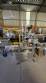 Automatic self-adhesive labeling machine for cylindrical bottles