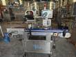 Automatic self-adhesive labeling machine for cylindrical bottles