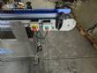 Automatic self-adhesive labeling machine for cylindrical bottles