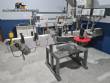 Automatic labeling machine for bottles, jars, and containers, for self-adhesive labels.