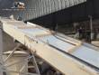 Inclined conveyor belt with talisca