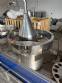 Milainox automatic rotary filling, dosing, and sealing machine for cups, pots, and jars.