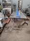 Stainless steel conveyor table with belt for accumulation assembly
