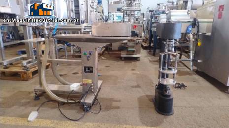 Filling machine with 2 nozzles for liquids and pilfer cap screwer