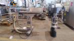 Filling machine with 2 nozzles for liquids and pilfer cap screwer