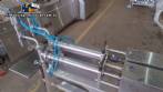 Filling machine with 2 nozzles for liquids and pilfer cap screwer