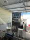 Packaging line with IMSB bung capper, Maqmundi labeler and accumulator table