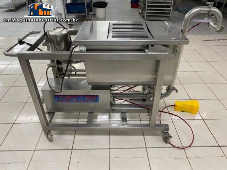 Unifiller stainless steel dosing pump with homogenizing mixer for bakery foods.