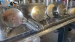 Gravimetric rotary filling machine in stainless steel with cabin
