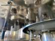Gravimetric rotary filling machine in stainless steel with cabin