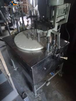 Erli rotary liquid filling machine with 4 pistons, 14,400 units per hour.