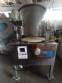 Erli rotary liquid filling machine with 4 pistons, 14,400 units per hour.