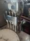 Erli rotary liquid filling machine with 4 pistons, 14,400 units per hour.