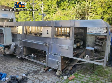 Filling line for 10 and 20 liter gallon jugs with filling machine and rinser/washer.