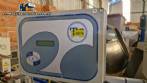 Automatic double-head labeling machine for cylindrical and flat bottles, Tudela, 3,000 labels per hour.