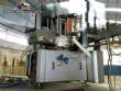 Krones automatic rotary label applicator for paper labels.