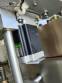 Labeling machine for dropper bottles with double printhead transparent stainless steel label