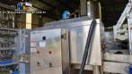 Labeling machine with steam sleeve tunnel and bottle baler