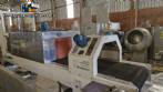 Labeling machine with steam sleeve tunnel and bottle baler