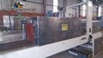Labeling machine with steam sleeve tunnel and bottle baler