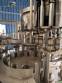Zegla rotary filling machine with rinser and three-block capping system.