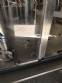 Zegla rotary filling machine with rinser and three-block capping system.