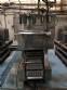 Automatic filling and sealing machine for gelatin cups, 12,000 units/hour.