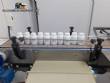 Filling line with capsule counter and screw machine