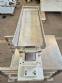 Vibrating trough for multi-head scale